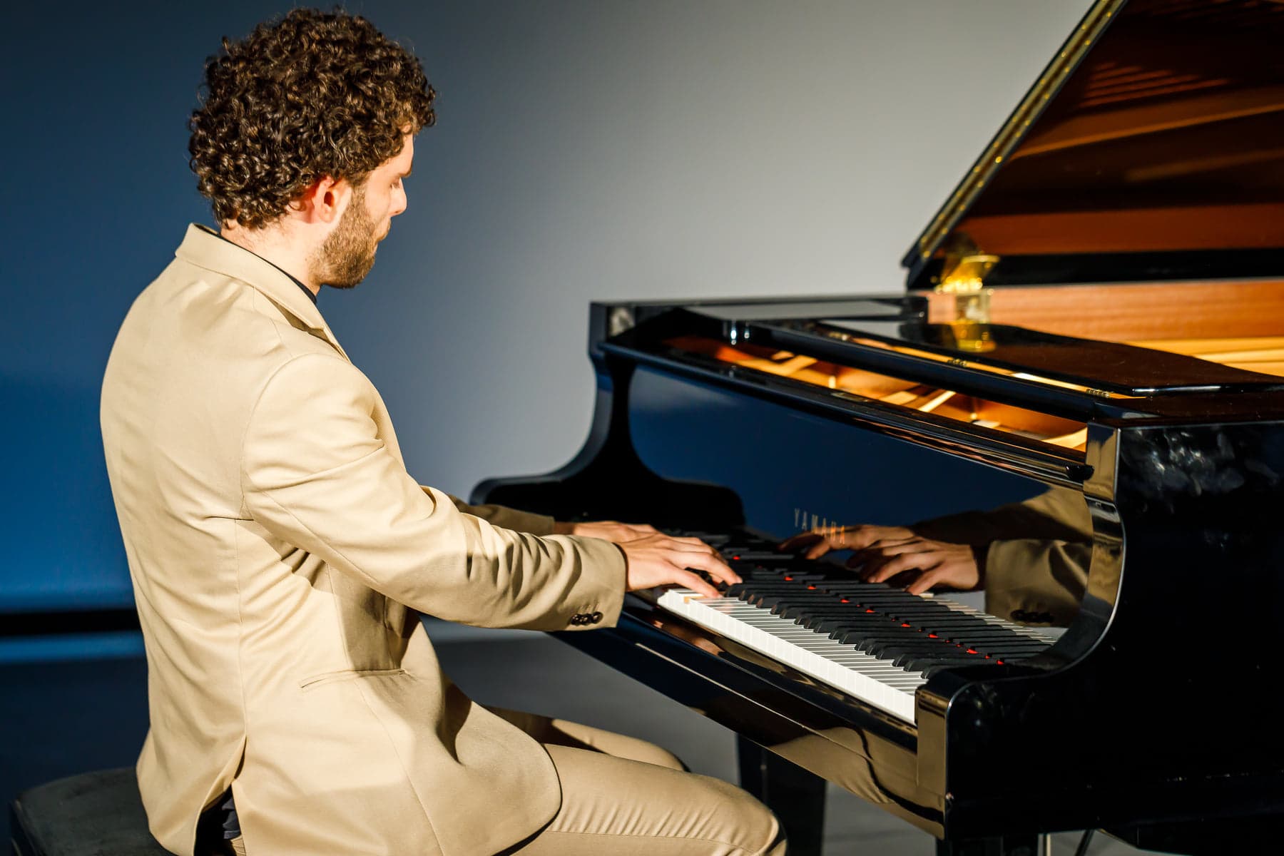 Playing in beige suit